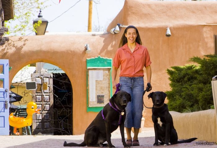 Latina-woman-dog-adobe-Mexico.jpg