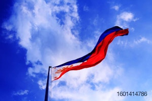 Philippine flag against a blue sky