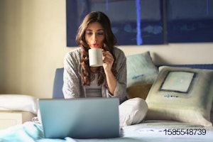 woman using gray laptop